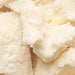Close-up of creamy coca butter as part of the natural ingredients list.