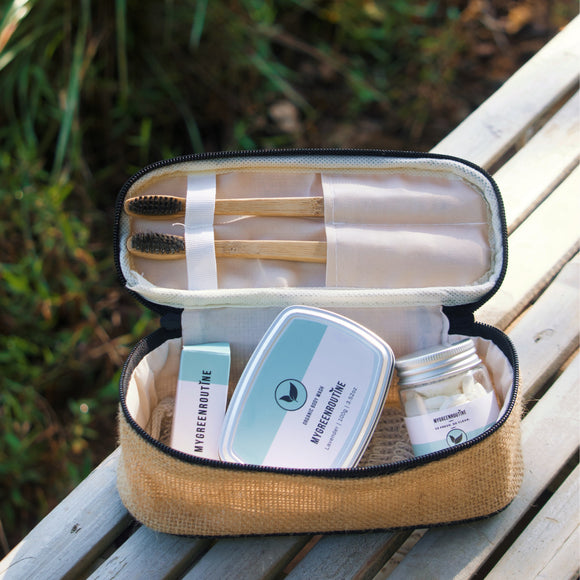 Open travel case with skincare products on a wooden surface outdoors