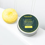 Moo Shine shampoo bar and container on a white background