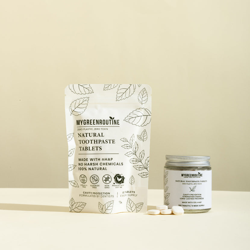 MyGreenRoutine natural toothpaste tablets packaging and jar on a beige background