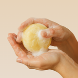 Model lathering rich and creamy lather made from naturally derived ingredients ion natural hair care bar.