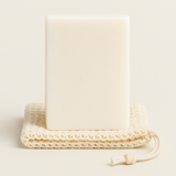 Natural and organic lavender body bar with no preservatives and essential oils stacked with cotton exfoliator