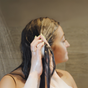 Applying a conditioner bar in shower