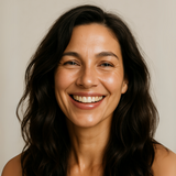 Natural studio photo of model post wash, showing volume and bounce with their hair styling. 