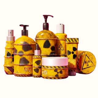 Collection of yellow and black themed skincare products with warning labels on a white background