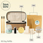 Collection of reusable products including a travel case, toothbrushes, and containers with 'My Green Routine' branding on a beige background.